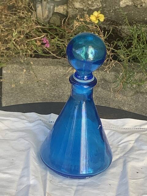 Blue bottle, glass vial for vintage perfume or liqueur.