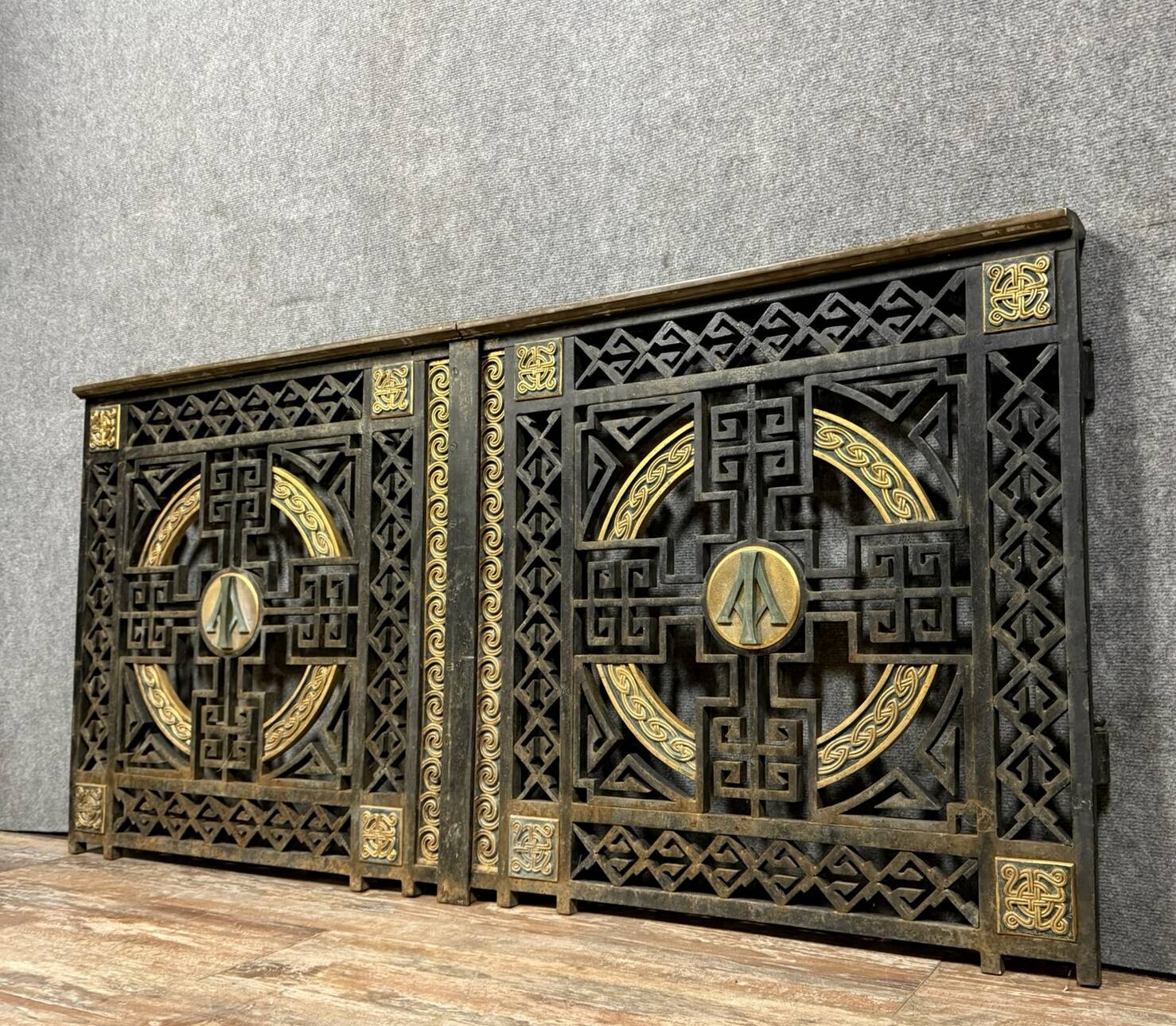 pair of monogrammed cast iron doors from the Art Deco period