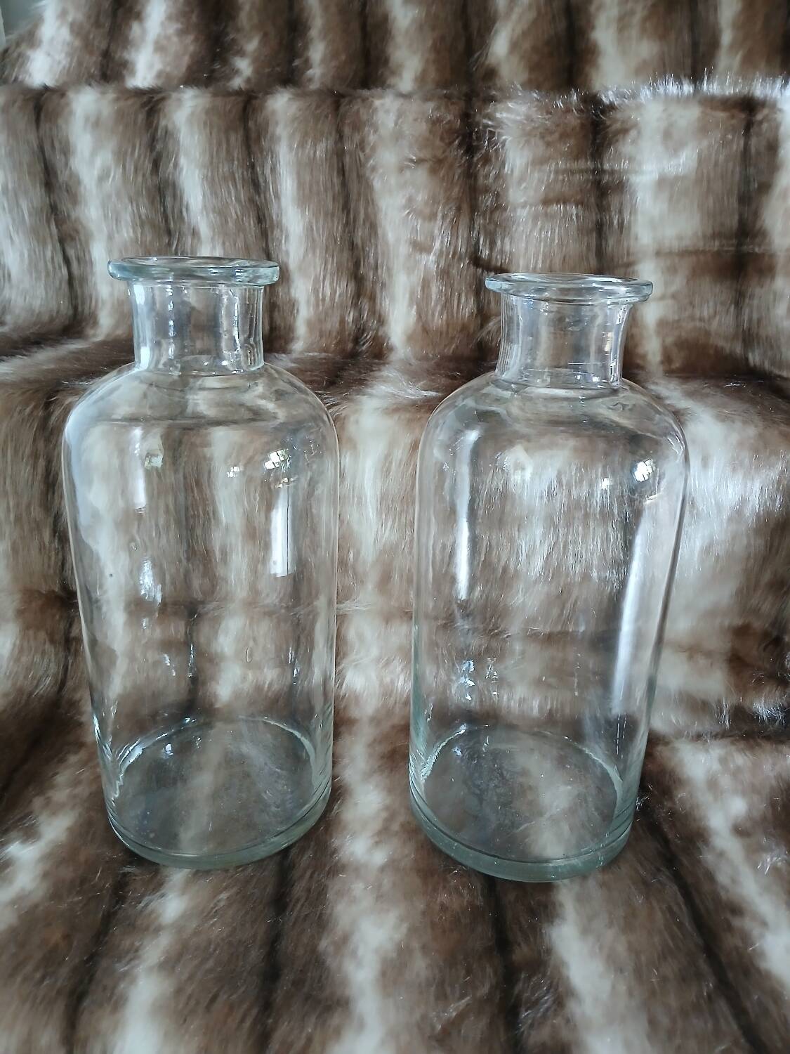 2 large antique transparent glass bottles