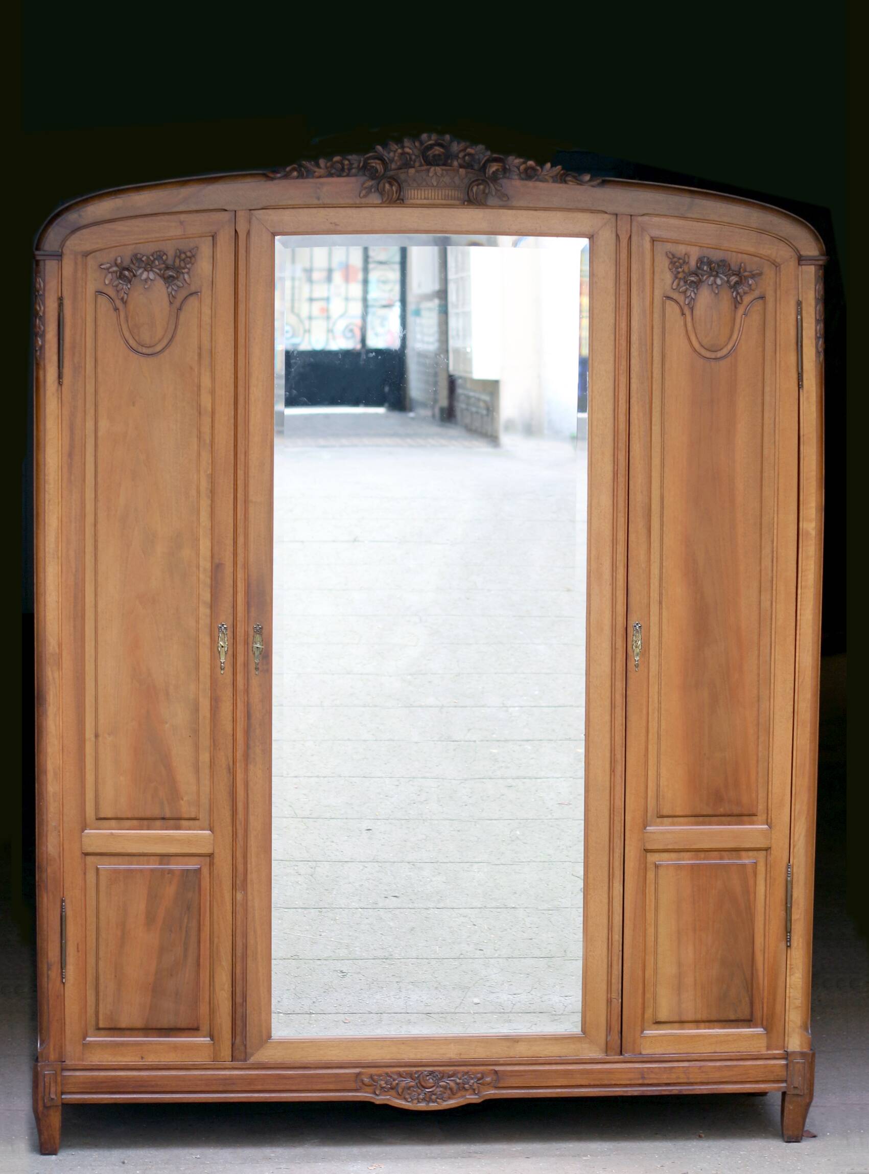 Majestic solid walnut wardrobe. Stamped work, late 19th century.