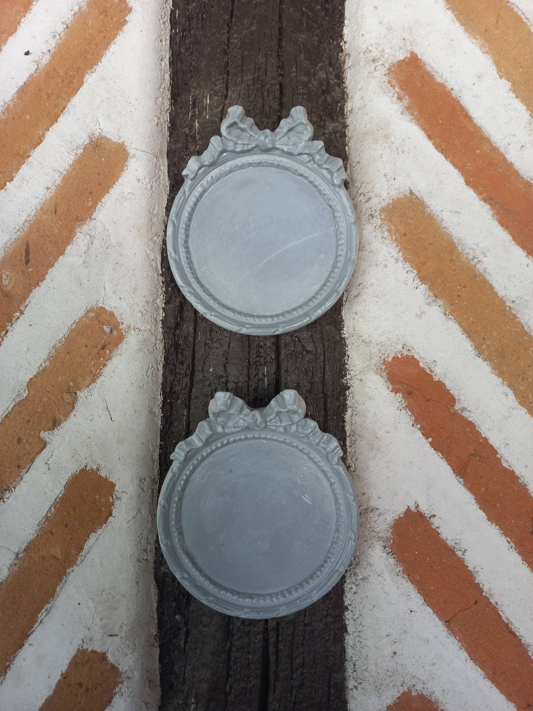 Pair of gray patinated plaster frames