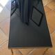 Table basse en laiton massif et plateau en verre noir