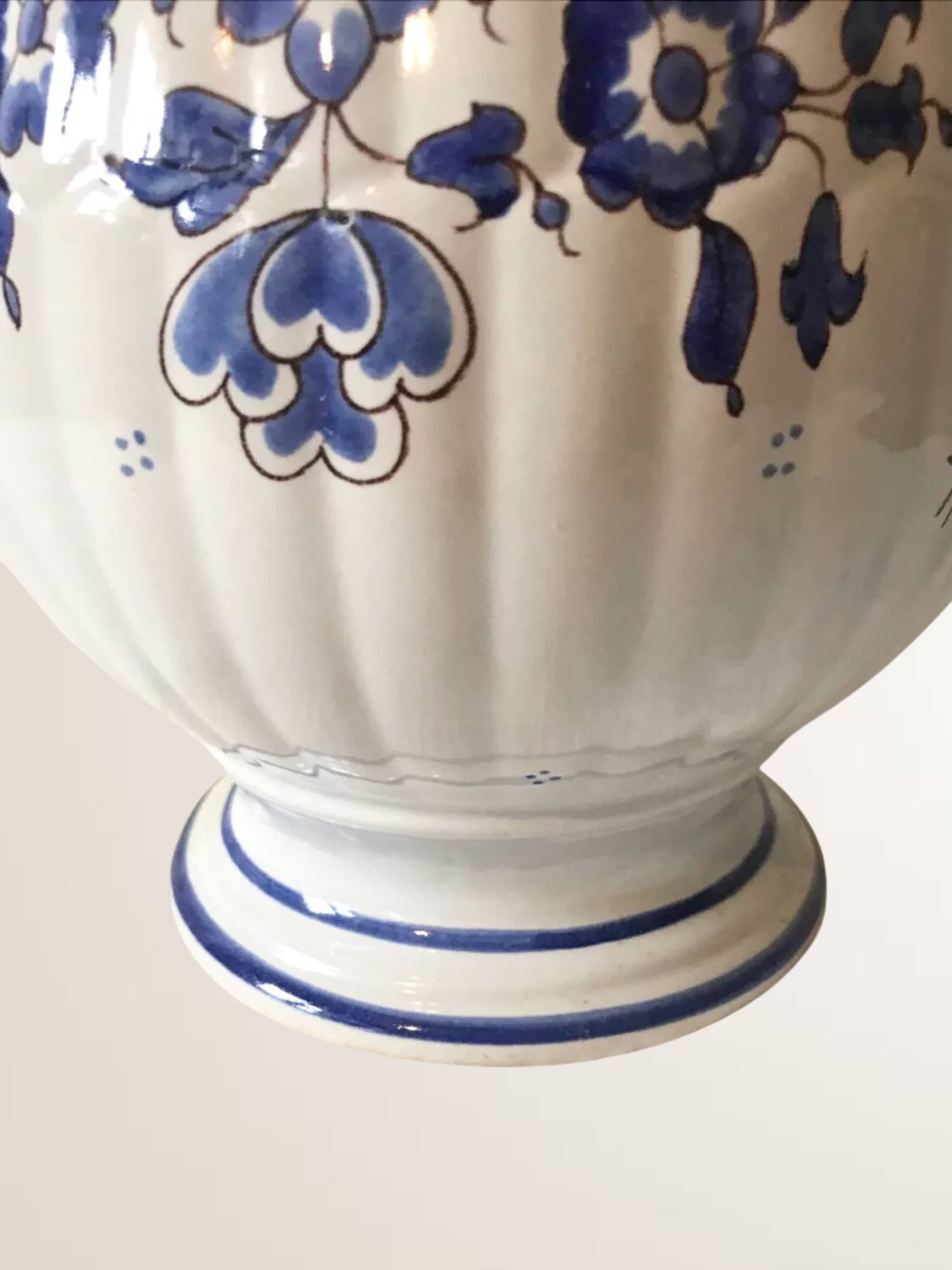 Moutiers earthenware jug, hand-painted blue decoration.