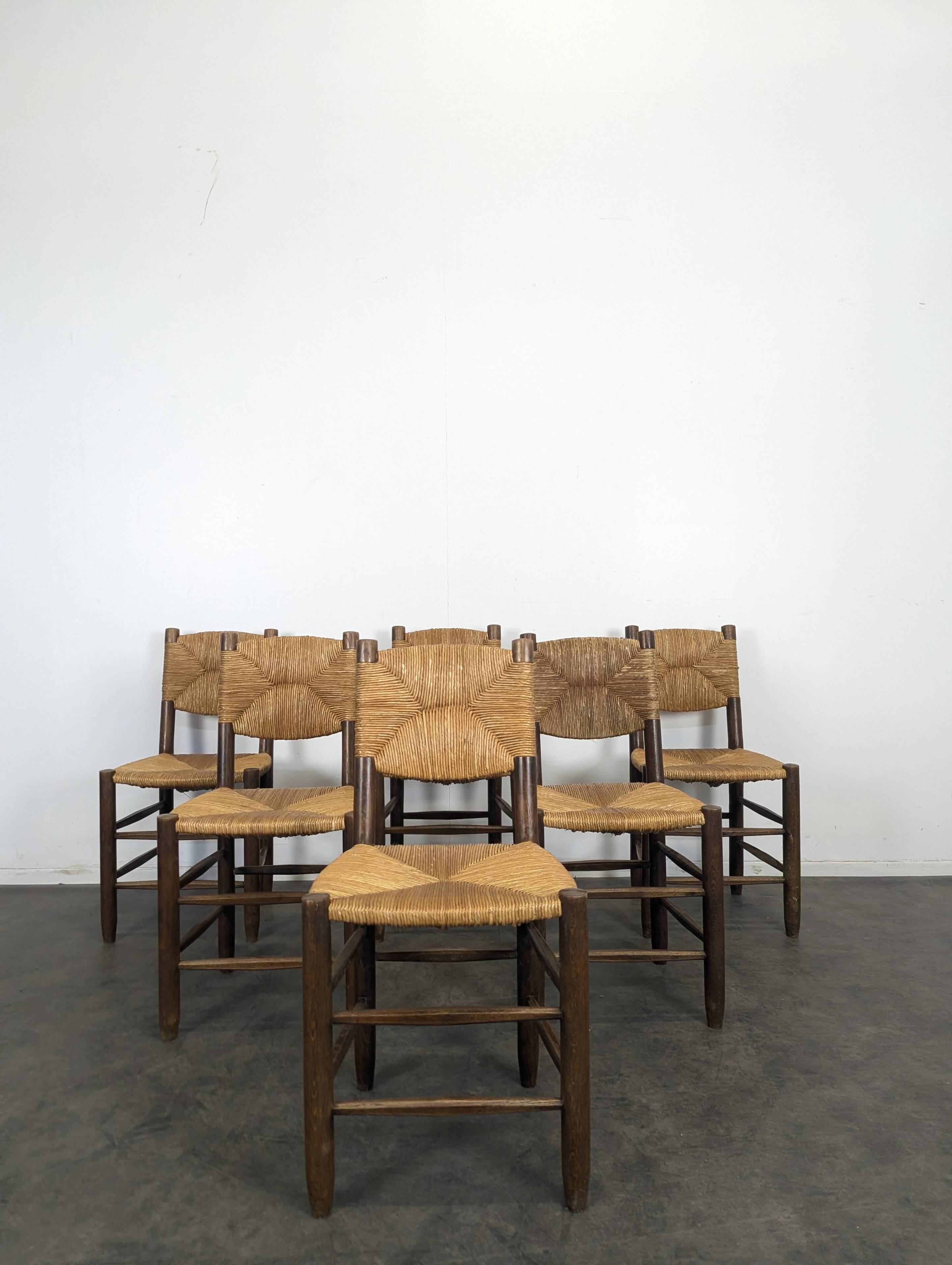 Série de 10 chaises modèle Bauche par Charlotte Perriand, circa 1960