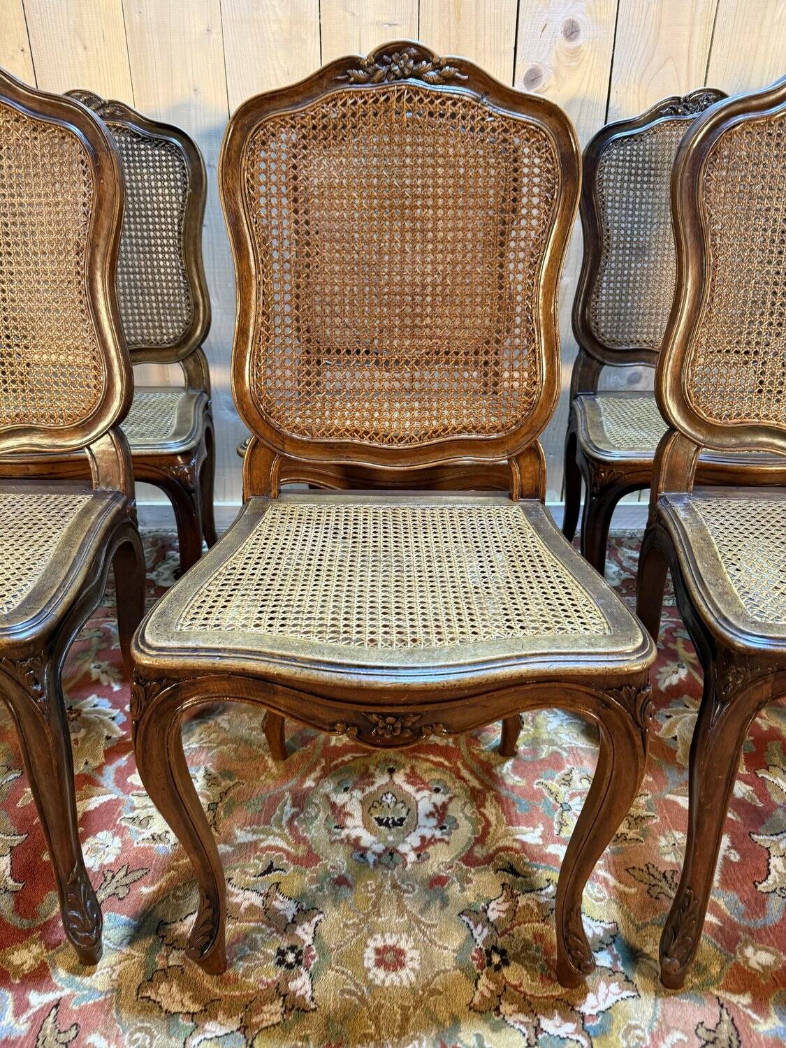 Set of 10 Louis XV style chairs in walnut and cane.
