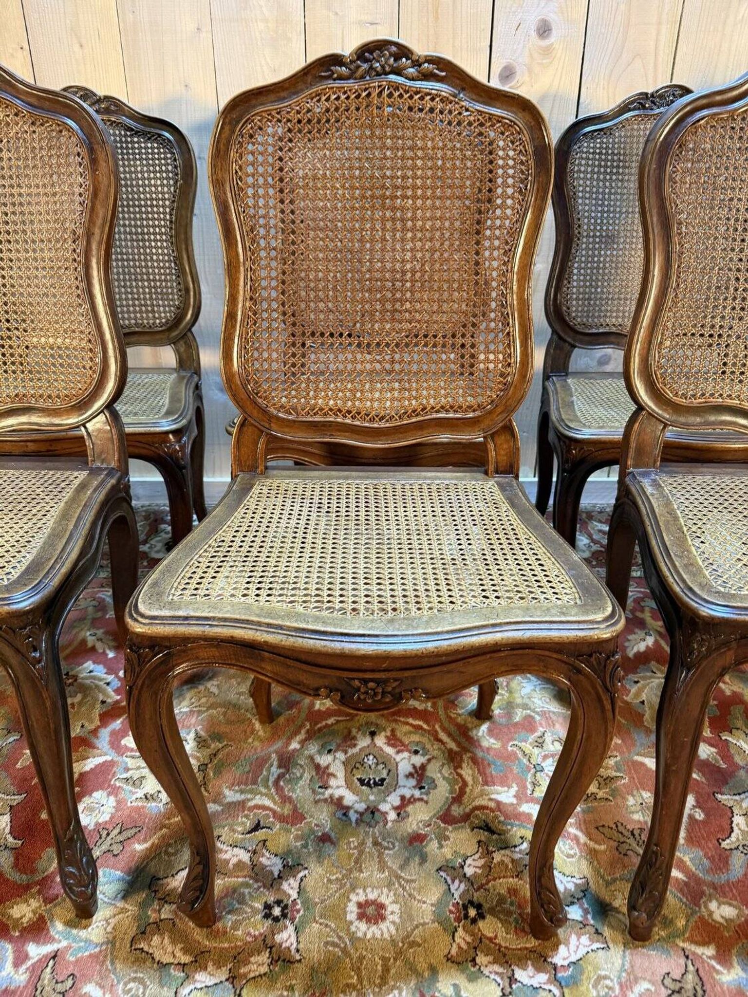 Set of 10 Louis XV style chairs in walnut and cane.