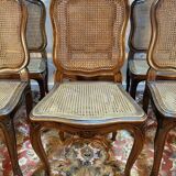 Set of 10 Louis XV style chairs in walnut and cane.