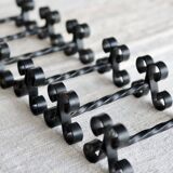 6 vintage black metal knife rests with scrollwork decoration