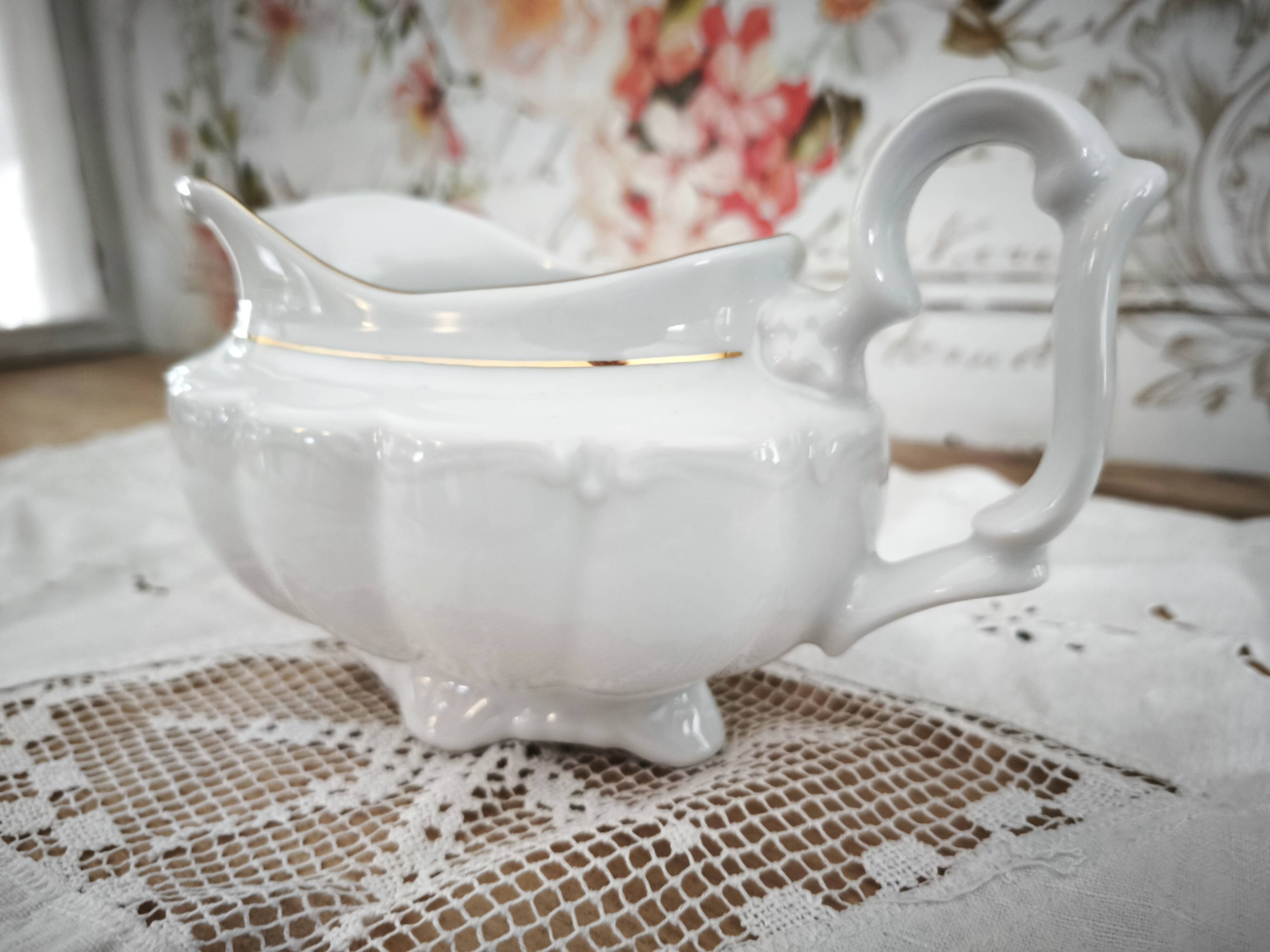 Porcelain sauceboat, white manufacture with double gold line, hand-painted.