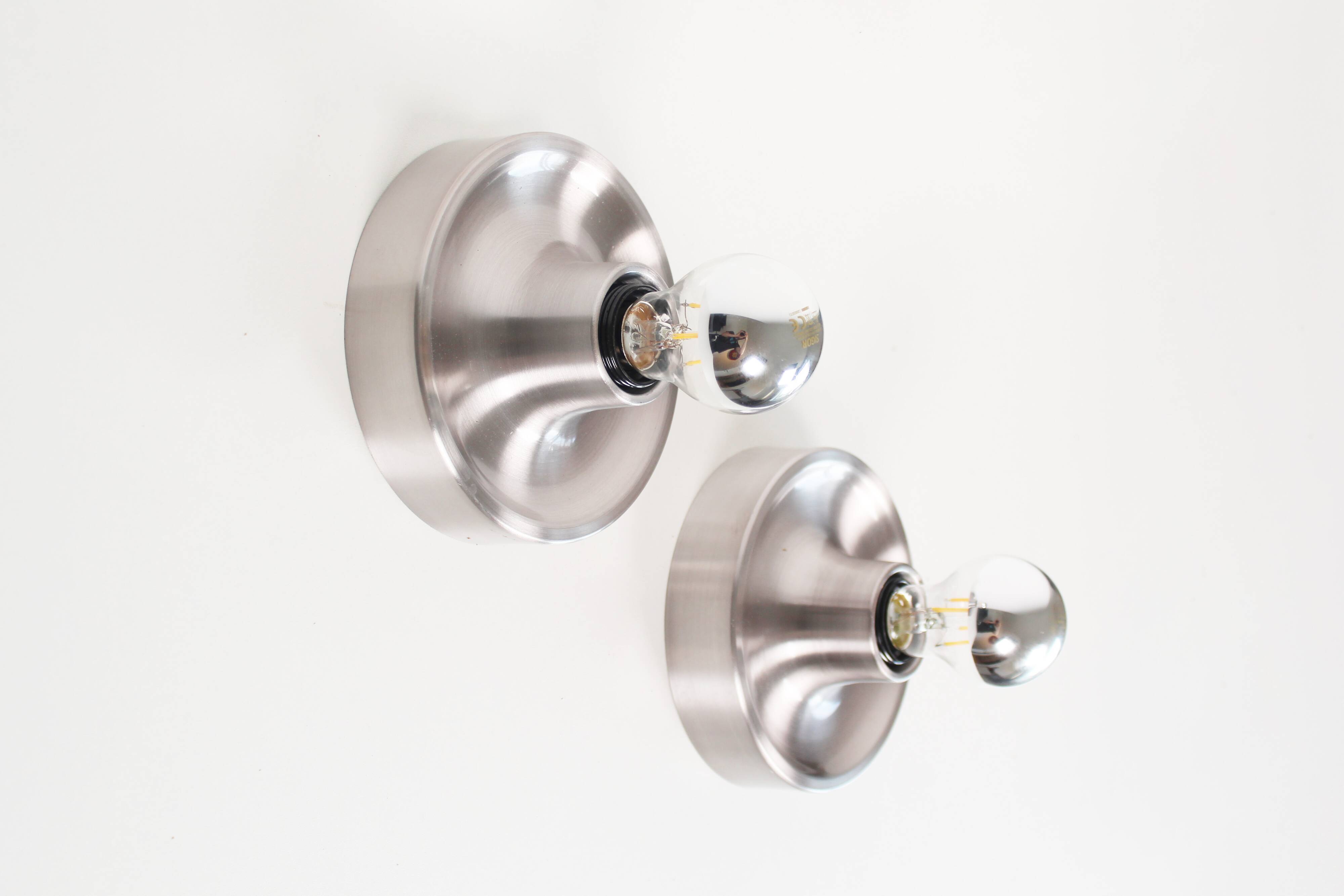 Pair of petite Disc sconces selected by Charlotte Perriand for Les Arcs