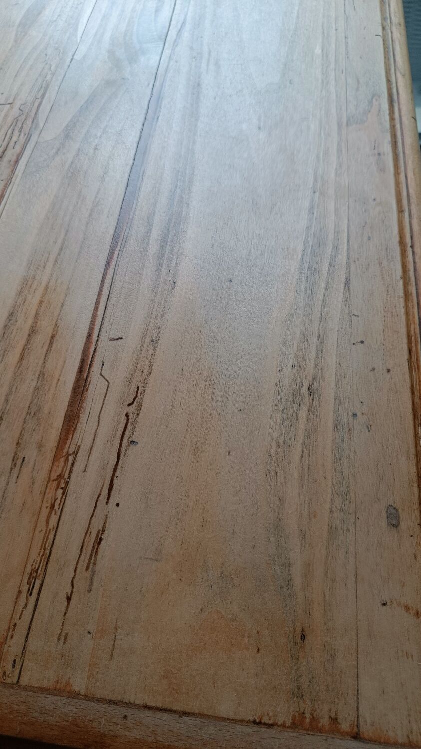 Antique wooden desk with a patinated base