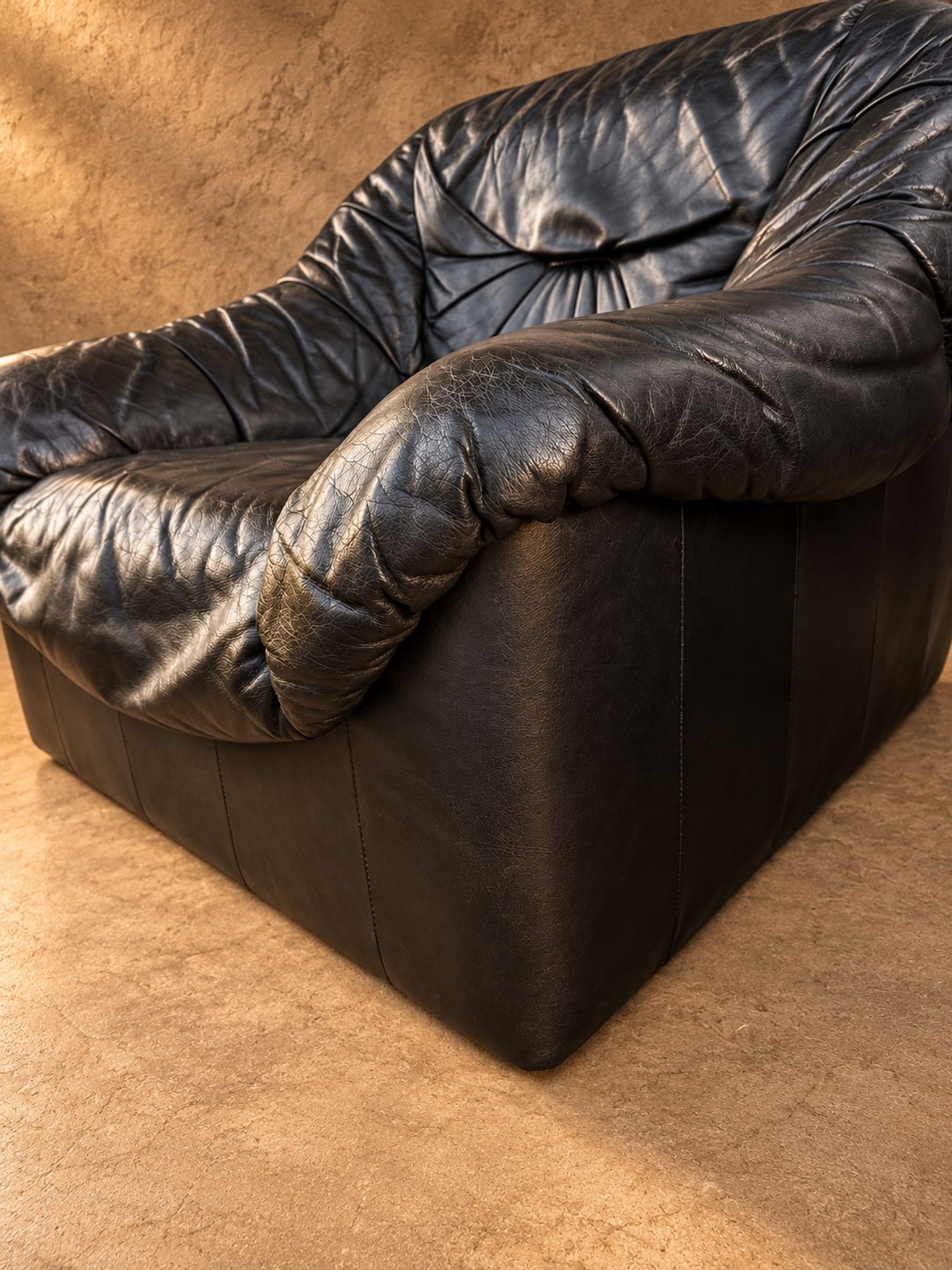 Leather armchairs and matching pouf, Italy, circa 1980