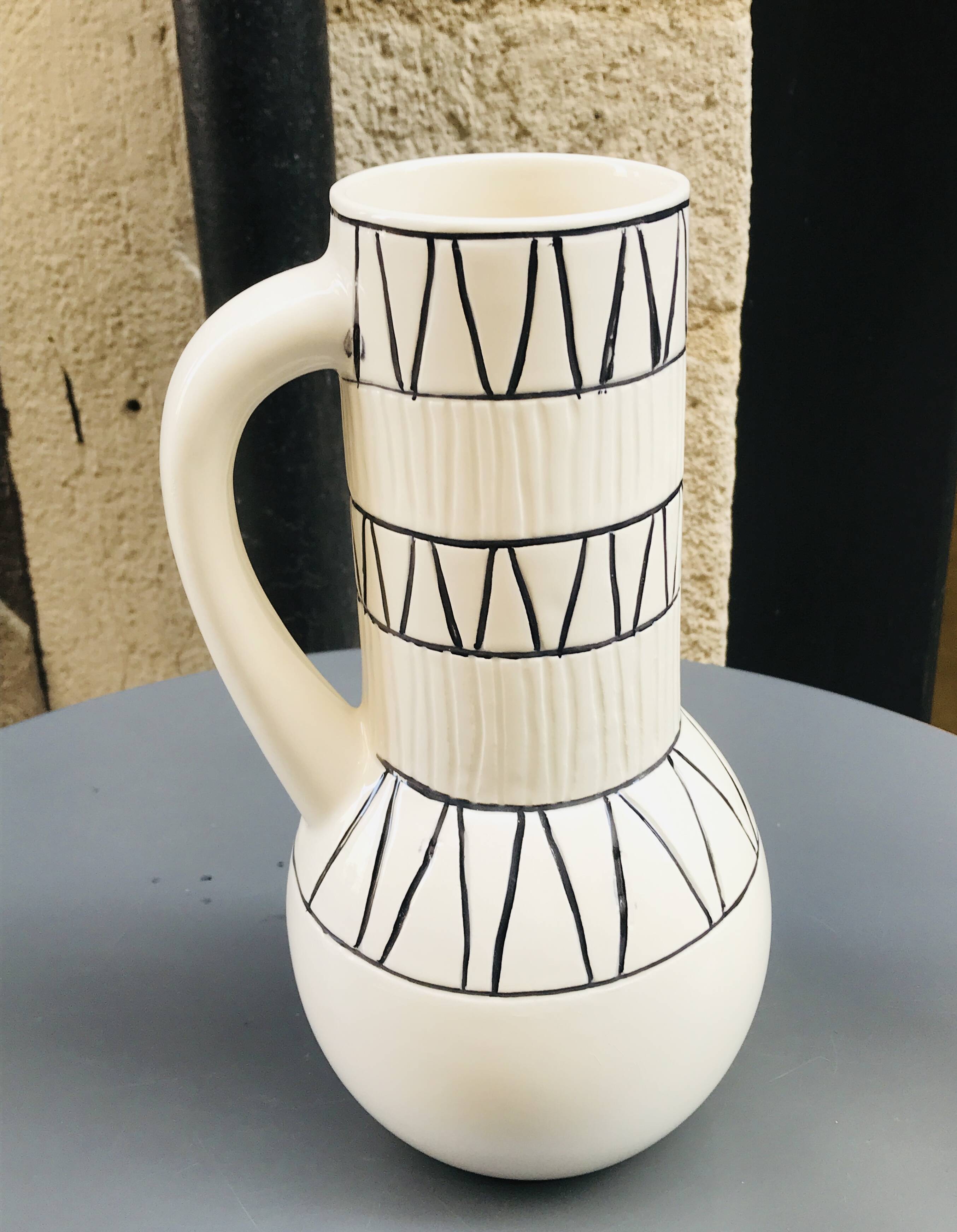 Vase with geometric pattern handles