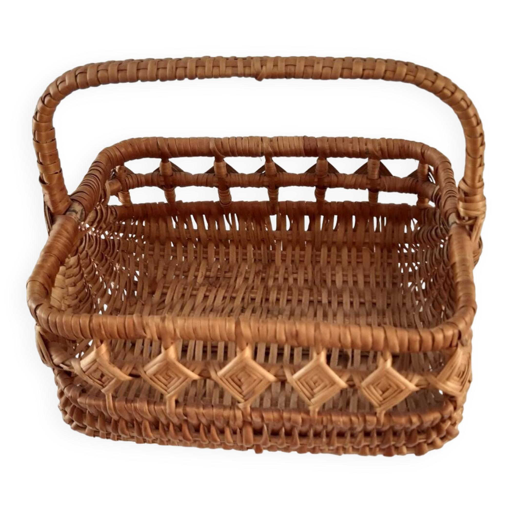 Old wicker basket with diamond-shaped decorations