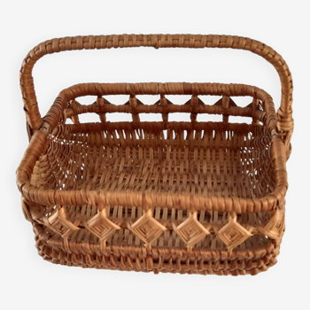Old wicker basket with diamond-shaped decorations