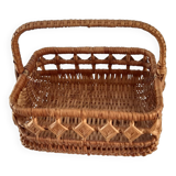 Old wicker basket with diamond-shaped decorations