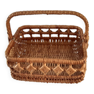 Old wicker basket with diamond-shaped decorations