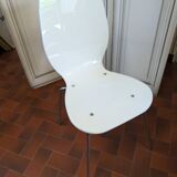 White plexiglass chair