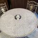 Foldable garden or terrace furniture set made of sheet metal and woven, perforated wrought iron, 5 pieces.