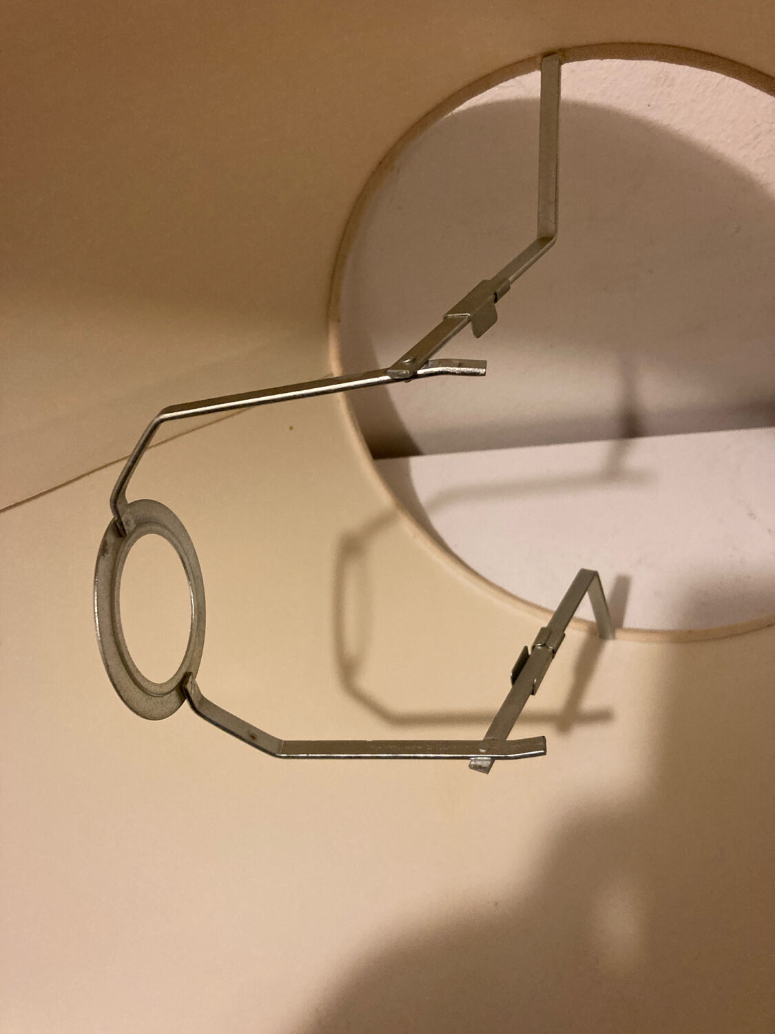 1980s ceramic table lamp with a wooden base and adjustable shade.