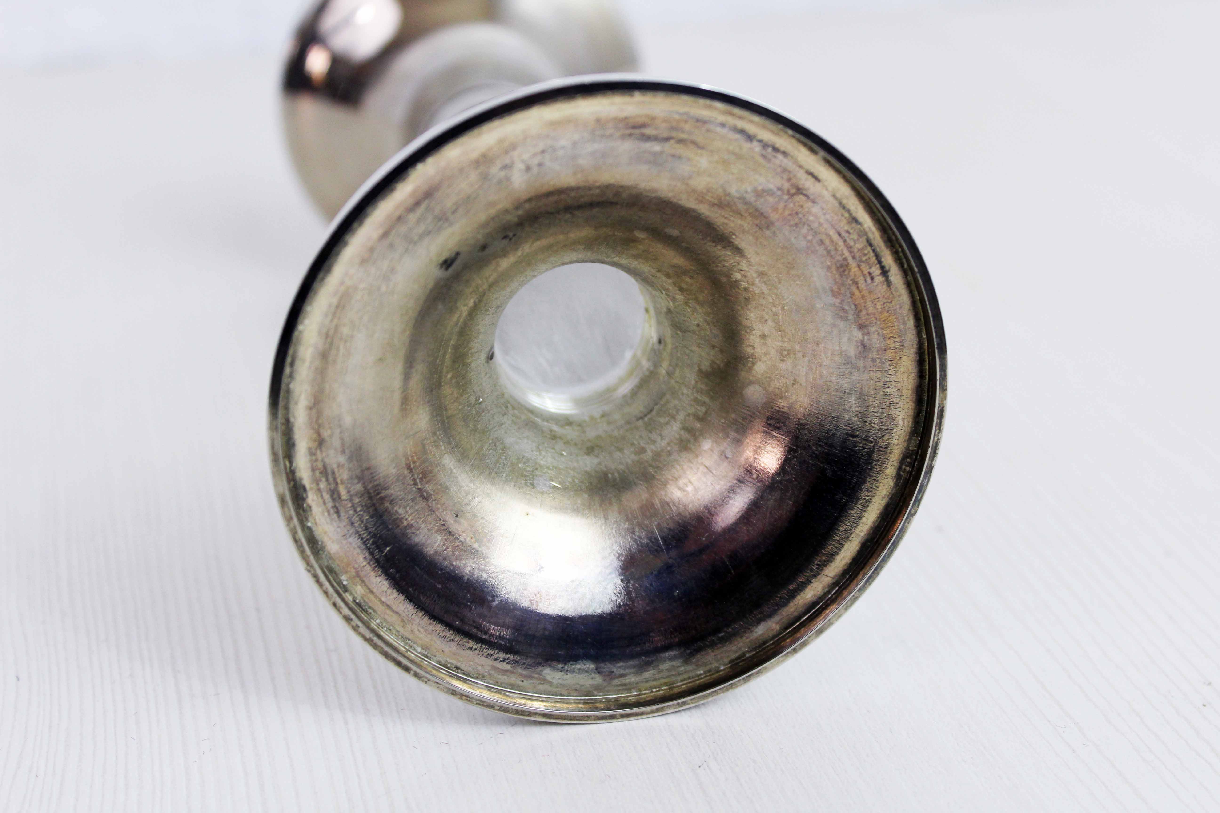 Candle holder in silver metal and lucite