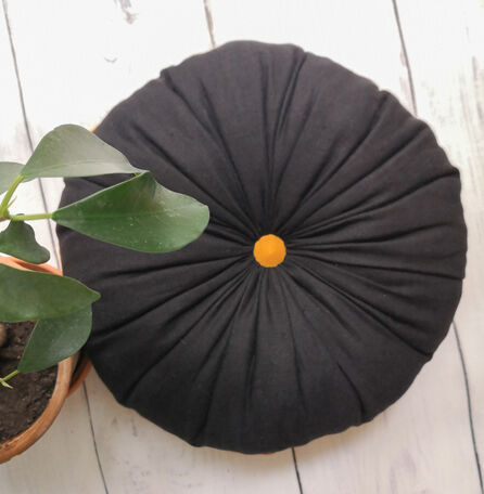 Round cushion in yellow