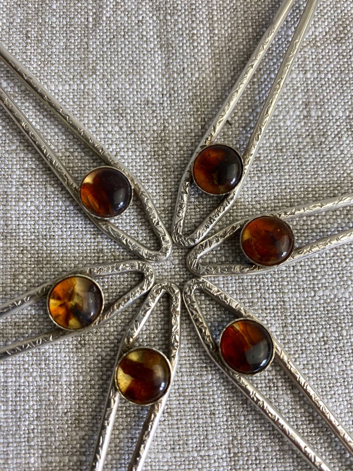 Art Nouveau metal and amber spoons