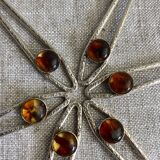 Art Nouveau metal and amber spoons