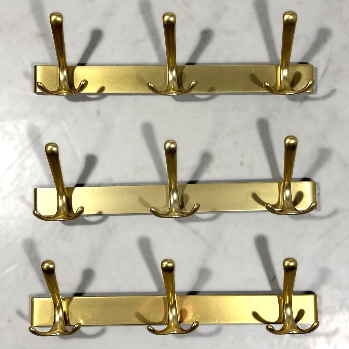 Gold coloured aluminium wall coat racks 1960’s