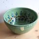 Large glazed ceramic salad bowl with a floral design.