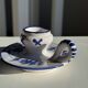 Dutch white and blue candlestick with windmill pattern.