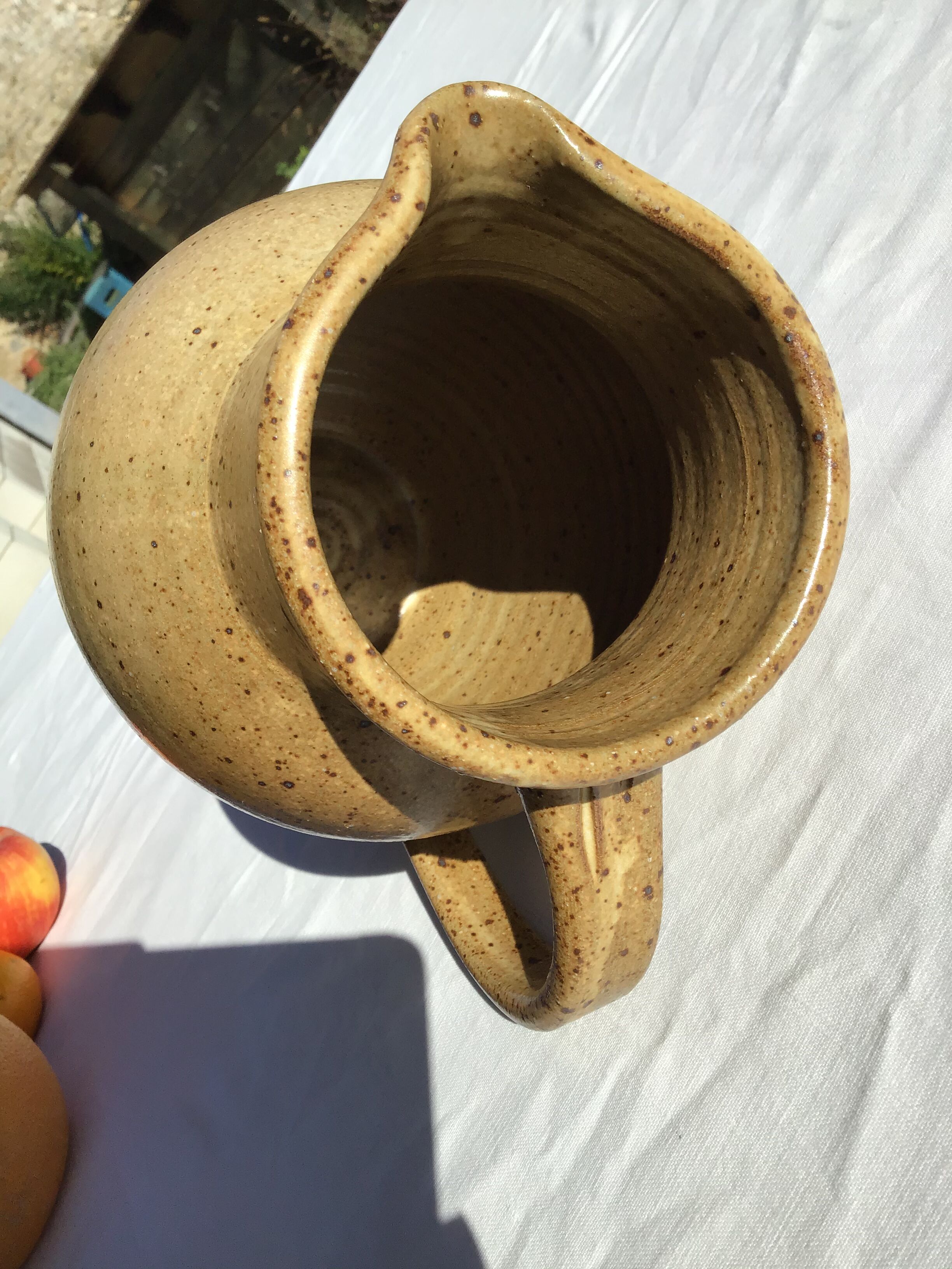 Beige handcrafted speckled sandstone pitcher