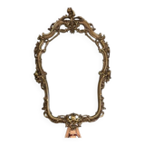 Rocaille style mirror from the 20th century in wood and gilded stucco, Putto on the pediment