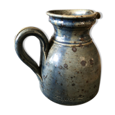 Handmade bluish enamelled sandstone pitcher speckled with brown