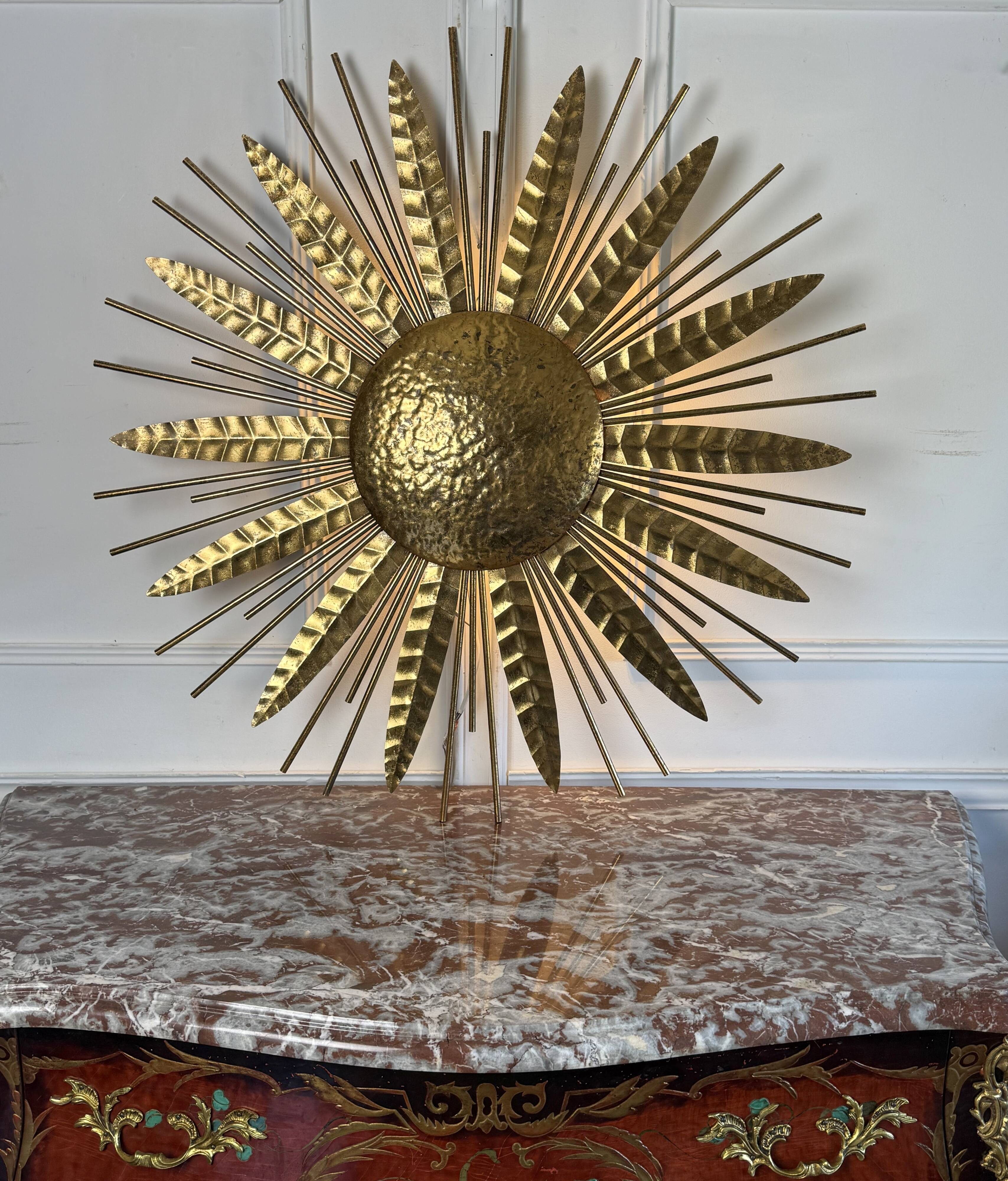 Large golden hammered metal sun wall light with a diameter of 90 cm from the year