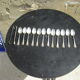 Set of twelve teaspoons and a sugar tongs