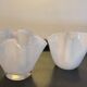 Duo of vintage handkerchief vases in glass paste