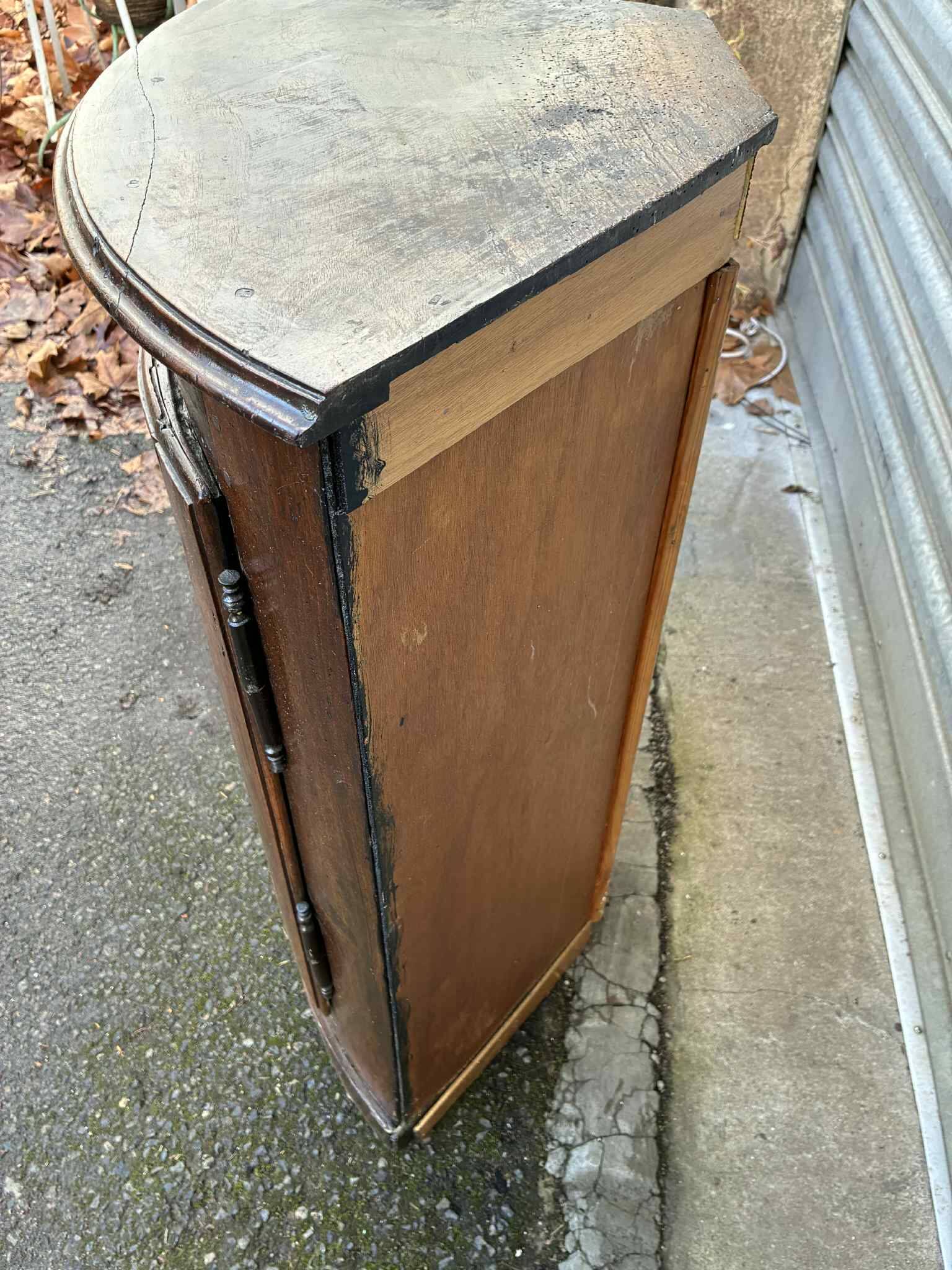 Small wooden corner accent table.