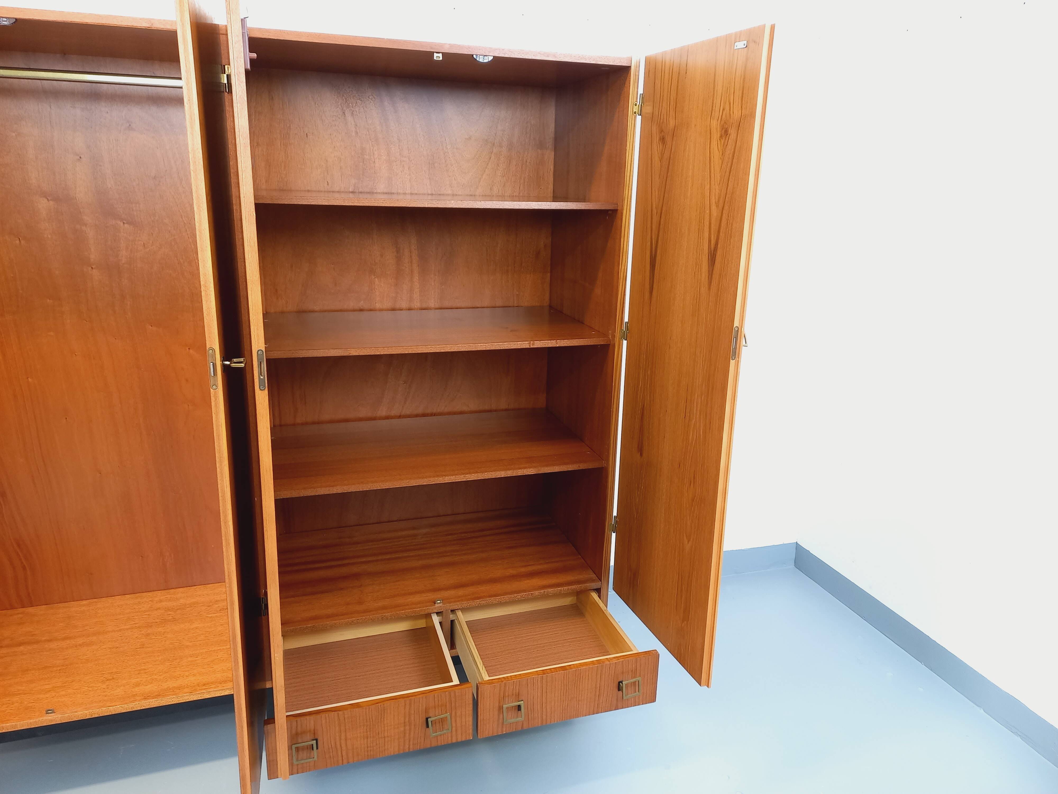 Vintage modernist wardrobe in teak and metal from the 1960s.