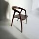solid wood chair with dark wood armrests