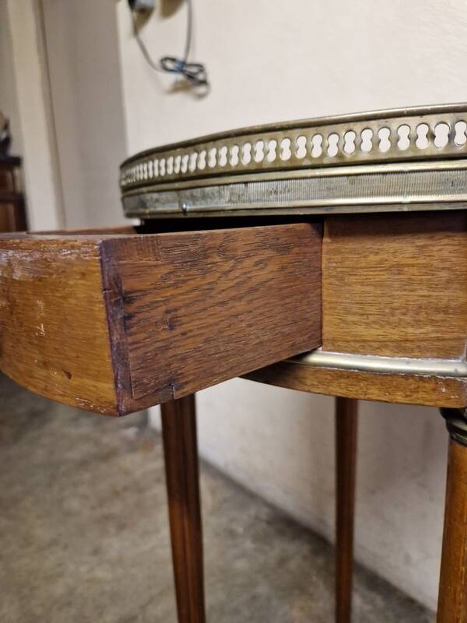 Louis XVI style bouillotte table in mahogany with a grey marble top.