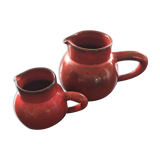 Pair of red pitchers
