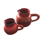 Pair of red pitchers