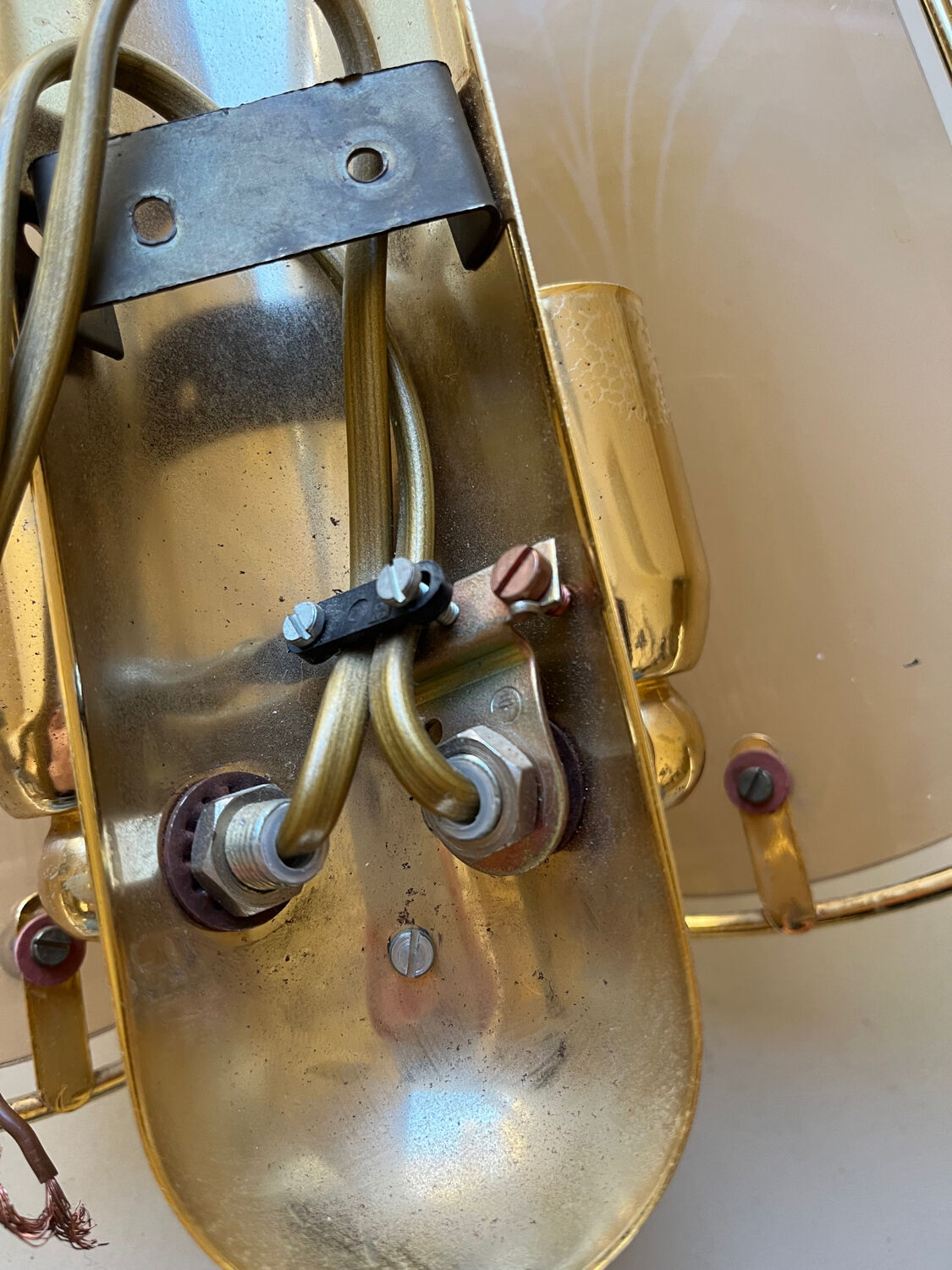 Pair of brass and smoked glass wall lights