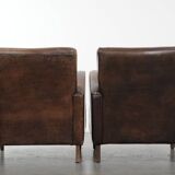 Set of two vintage sheepskin leather design armchairs in a cognac colour