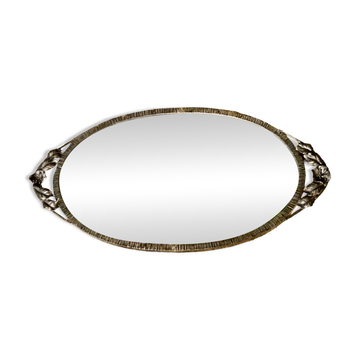 Bevelled oval mirror, richly crafted Art Deco wrought iron.