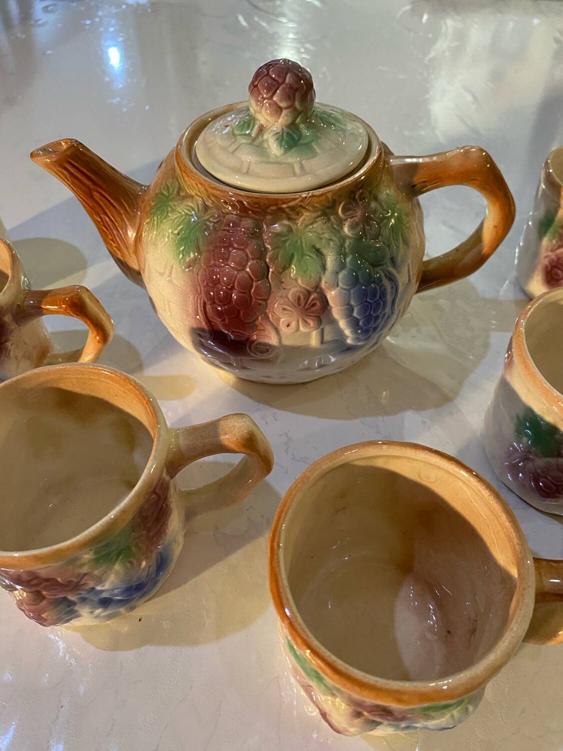 Vintage earthenware teapot and cup set