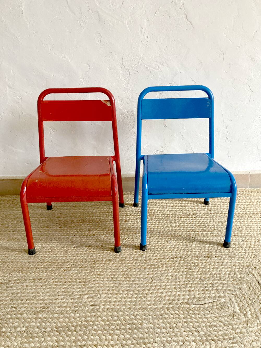Pair of Mullca nursery chairs in metal and wood painted red and blue