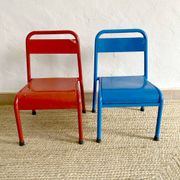 Pair of Mullca nursery chairs in metal and wood painted red and blue