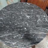 Pedestal table with gray depression marble
